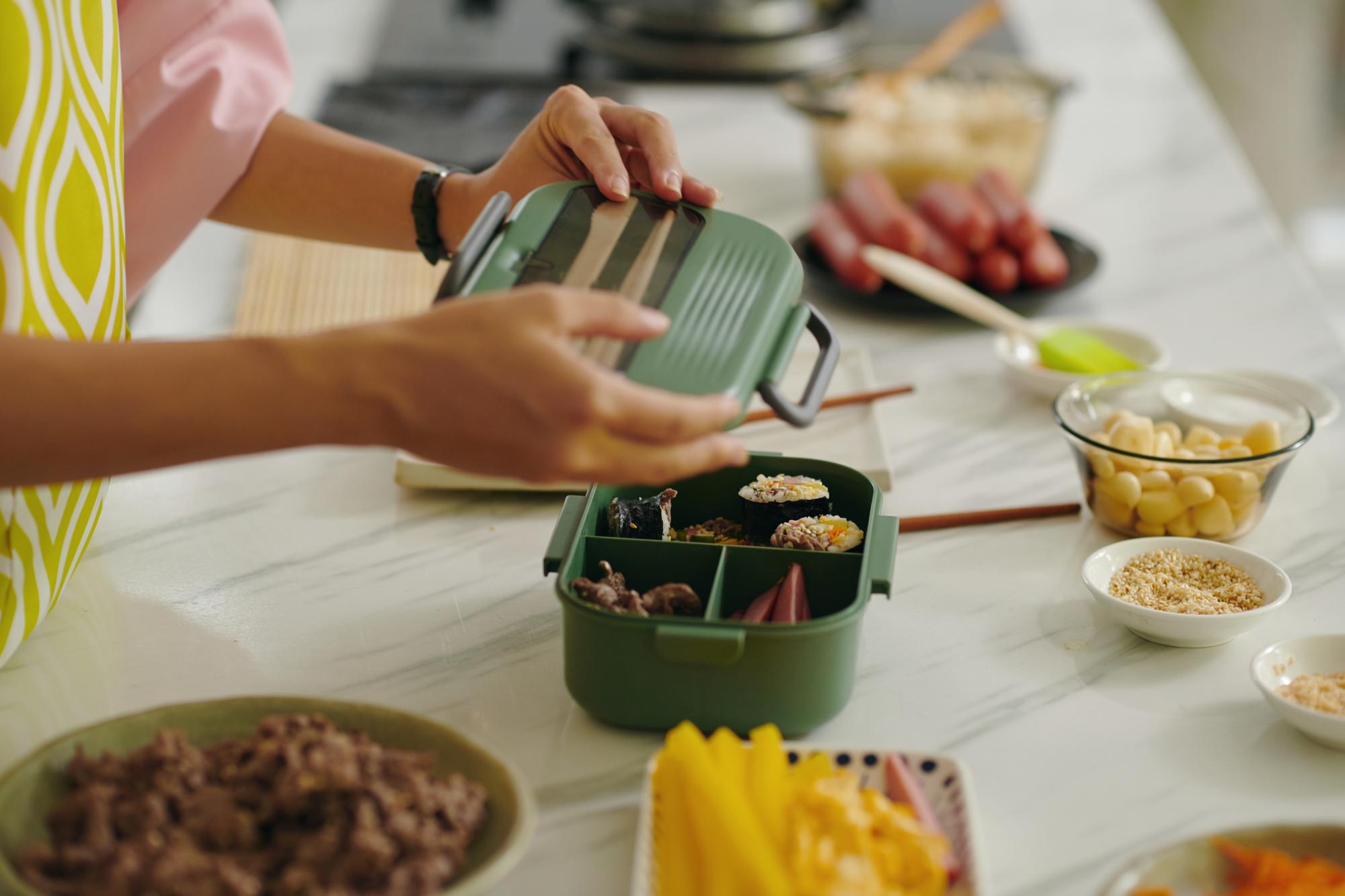 Bento-style meal prep with labeled containers